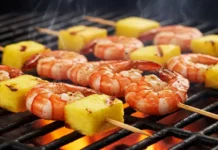 Shrimp Pineapple Skewers Recipe: Grilled & Delicious Shrimp and pineapple skewers sizzling and charring on the hot grates of a barbecue grill.